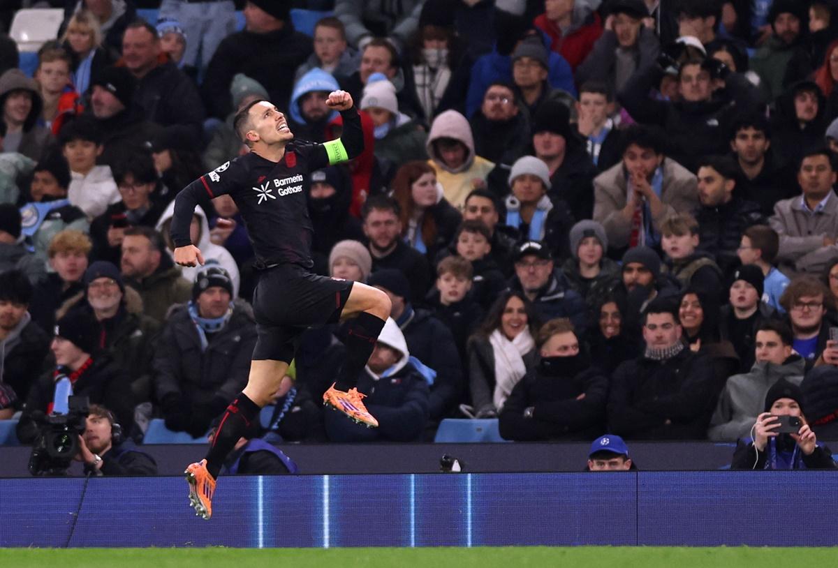 Alex Grimaldo celebrates putting Bayer Leverkusen ahead in the match against Manchester City at Etihad Stadium, Manchester.