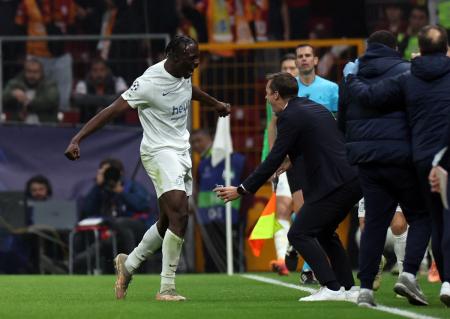 Union Saint-Gilloise's Promise David celebrates with coach David Hubert after scoring the only goal of the match against Galatasaray at Rams Park, Istanbul, Turkey.