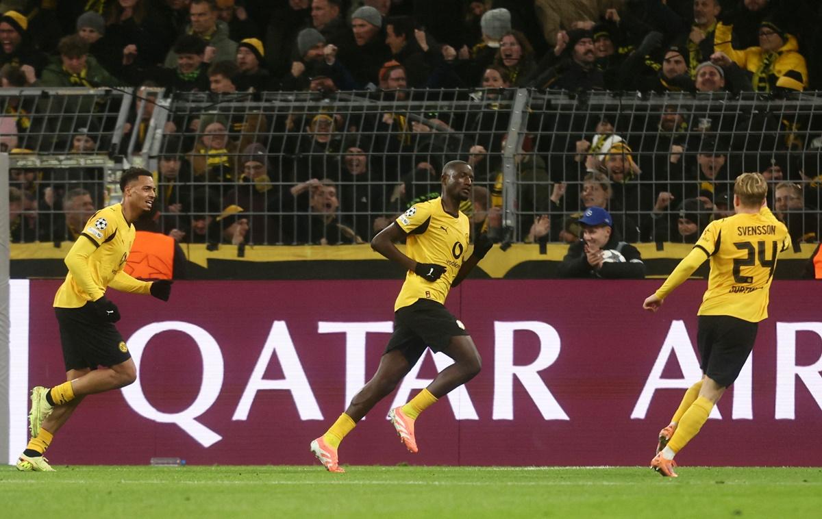 Serhou Guirassy celebrates scoring Borussia Dortmund's first goal with Felix Nmecha and Daniel Svensson during the match against Villarreal at Signal Iduna Park, Dortmund, Germany.