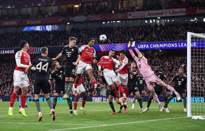 Jurrien Timber scores Arsenal's first goal against Bayern Munich, at Emirates Stadium, London.