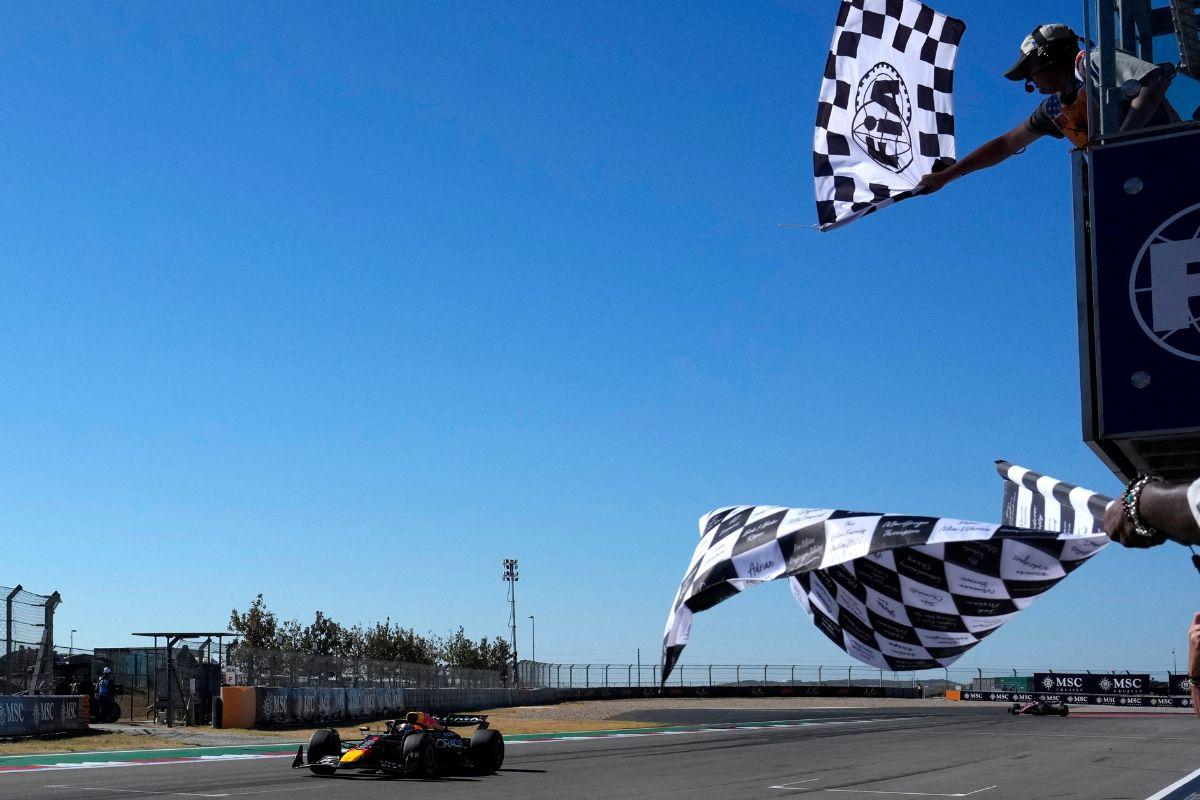 Red Bull's Max Verstappen passes the chequered flag to win the United States Grand Prix
