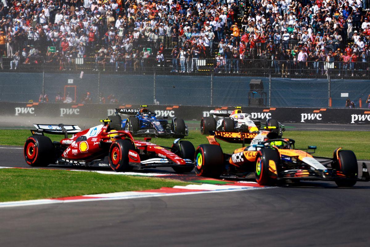 McLaren's Lando Norris and Ferrari's Lewis Hamilton in action during the race 