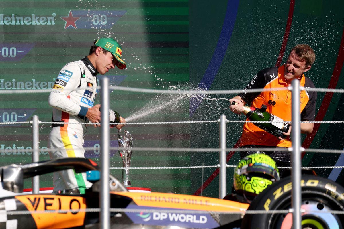 McLaren's Lando Norris celebrates with champagne on the podium after winning the Mexico City Grand Prix at Autodromo Hermanos Rodriguez, Mexico City, Mexico, on Sunday