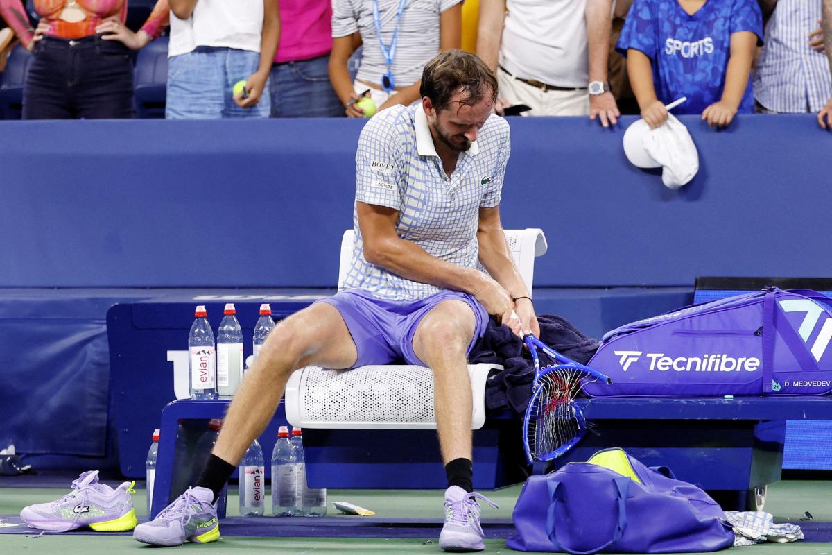 Russia's Daniil Medvedev breaks his racquet after his US Open first round match against France's Benjamin Bonzi on August 25