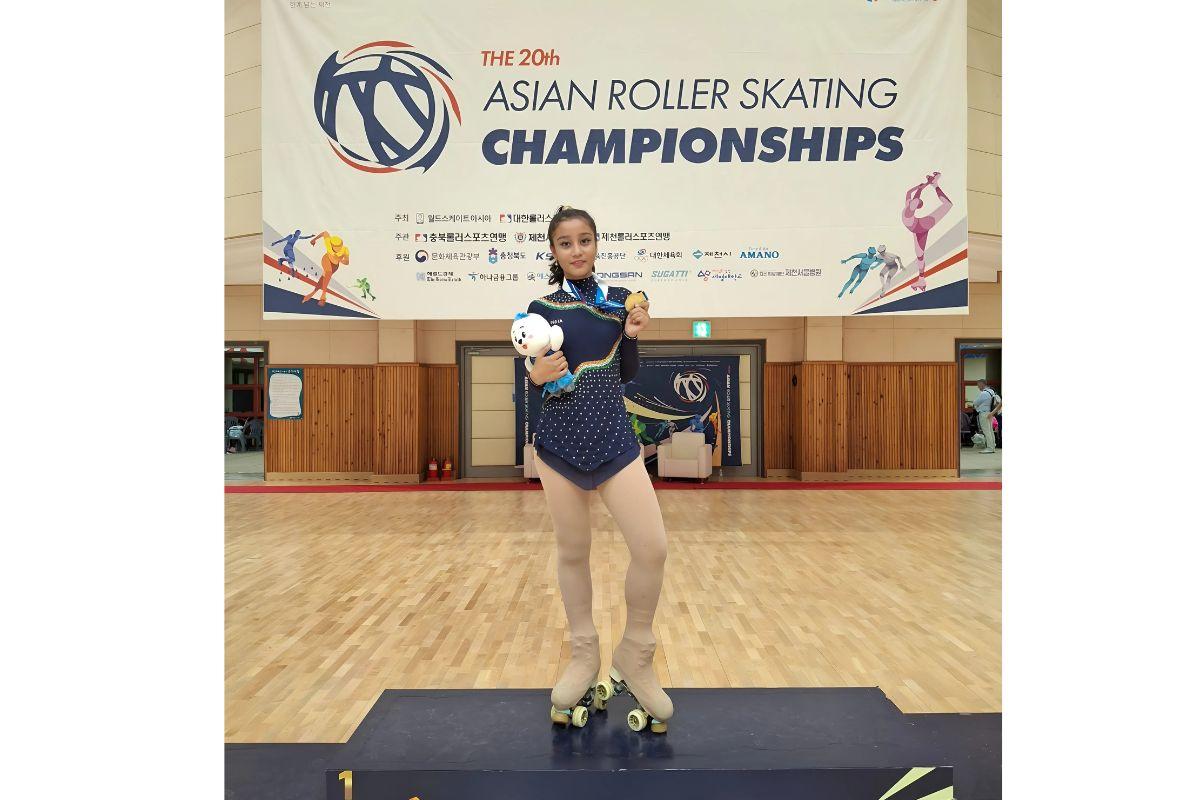 Naisha Mehta poses on the podium after winning the gold medal at the 20th 20th Asian Roller-Skating Championship in South Korea, on July 31, 2025