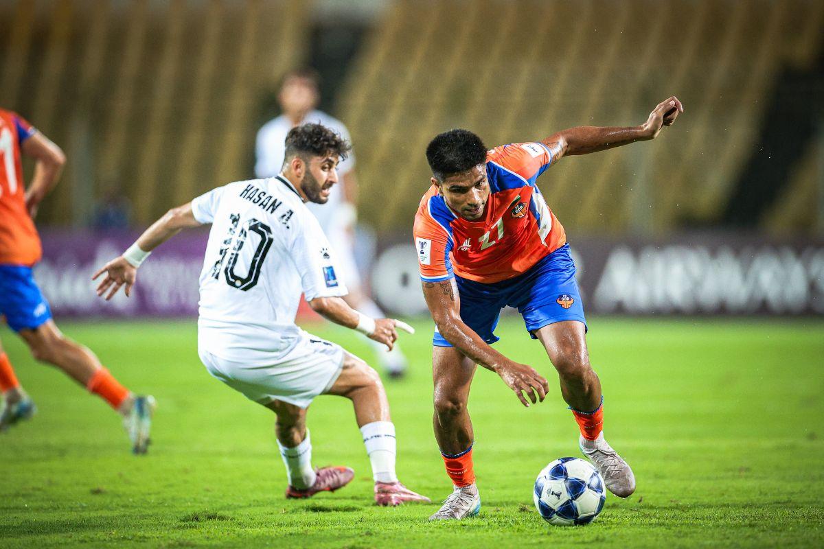 FC Goa's Aakash Sangwan wins the ball in a duel with Al Zawraa SC's Hasan Abdulkareem Sayyid during their AFC Champions League Two Group D match at the Jawaharlal Nehru Stadium in Fatorda, Margao, on Wednesday
