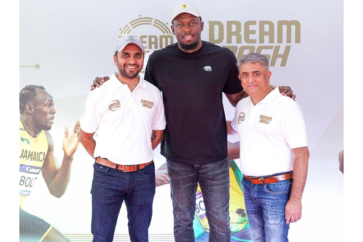 Usain Bolt with DreamSetGo’s founders, Monish Shah and Daniel D’Souza